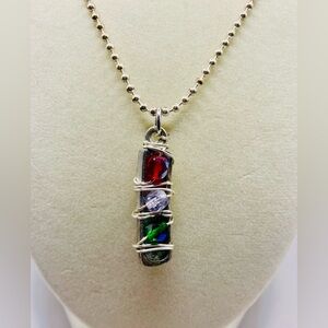 Avant Garde long bar crystal pendant with a wire wrapping on a thin ball chain